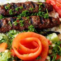 Beef Kofta Plate · Skewered of tender marinated ground beef, grilled to perfection. Served with rice, salad, hu...