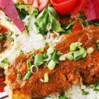 Chicken Tikka Masala · Tender boneless chicken marinated in spices served with a decadent tomato and onion butter c...