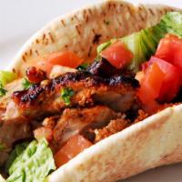 Chicken Kebab Wrap · Juicy chunks of marinated grilled chicken, with our signature garlic sauce on the side.