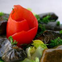 Grape Leaves · Four piece, hand rolled, stuffed with rice, tomatoes, parsley, onions and spices.