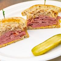 Reuben · Corned beef on grilled rye with melted swiss cheese, sauerkraut, 1000 island, and spicy Must...