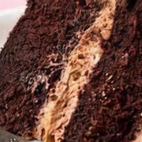 Fudge Cake  · Cake layered with rich chocolate fudge icing, and finished with chocolate cream