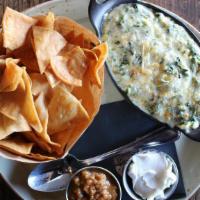 Classic Spinach & Artichoke Dip · Homemade tortilla chips, charred salsa, sour cream