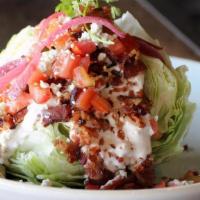 Iceberg Wedge · applewood smoked bacon, tomato, pickled red onion, blue cheese crumbles, creamy blue cheese ...