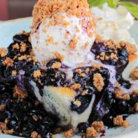 Blueberry Biscuit Cobbler · served with french vanilla bean ice cream, warm lemon blueberry sauce and an oatmeal crumb t...