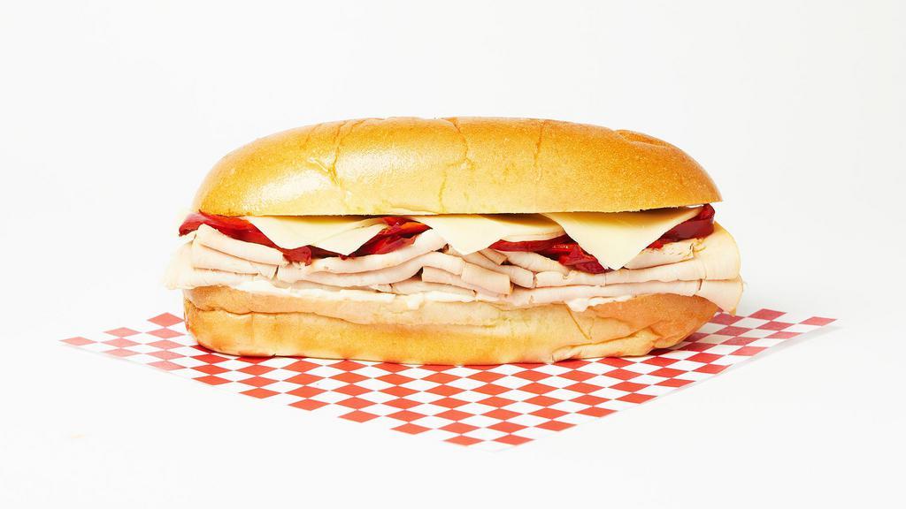 The Turkey Italian Sub · Sliced turkey, roasted red peppers, and mozzarella on a hoagie roll.