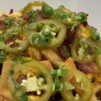 Lake Fries · House cut fries with bacon, Cheddar cheese and in-house pickled jalapeños.