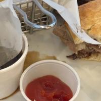 French Dip · Thinly sliced tri tip, au jus, grilled onions, Swiss.