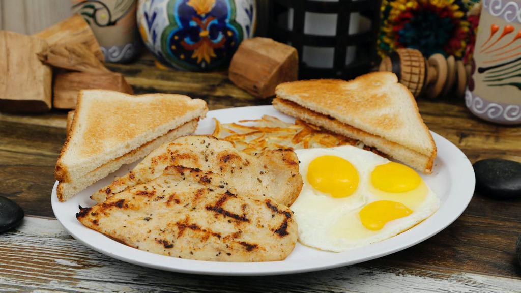 Chicken Breast & Egg Breakfast · Grilled chicken breast seasoned with side of hashbrown, eggs an toast with jelly on the side