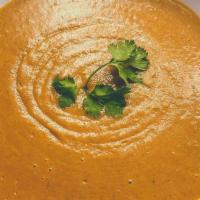 Sunny Pumpkin Cream Soup · Fresh pumpkin cooked in an exquisite creamy soy milk and potato blend. Seasoned with cinnamo...