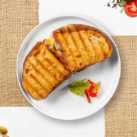 Ham Cheese Panini · Ham and cheese served on toasted bread.