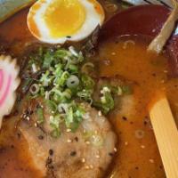 Spicy Tonkotsu Ramen · Wavy noodles in our special spicy pork broth topping with chashu pork belly, black garlic oi...