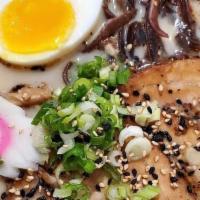Tonkotsu Ramen · Wavy noodles in our special pork broth topping with chashu pork belly, black garlic oil, bam...