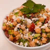 Mediterranean Chickpea Salad · Chickpea, coriander, red onion, feta cheese, cherry tomato, cucumber avocado.