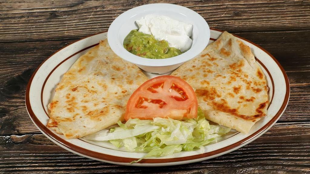 Single Quesadilla · Flour tortilla, Monterey Jack Cheese, with guacamole & sour cream *Choice Of Any Meat +3.00