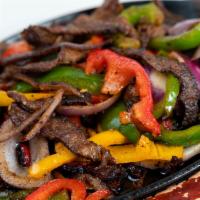Fajitas De Pollo O Res · Chicken or Beef Sauteed with Onion, Tomato & Bell Peppers.