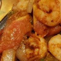 Shrimp Fajitas · Succulent strips simmered in a special sauce and sauteed with fresh tomatoes bell peppers on...