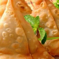Medium Size Vegetables Samosa (2 Pieces) · Triangle shaped patties stuffed with fresh potatoes, green peas & ground Himalayan spices th...
