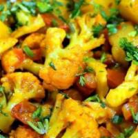 Aloo Gobi (Potato & Cauliflower) · Cauliflower and potato cooked in onion and tomato sauce in combination with Himalayan herbs ...