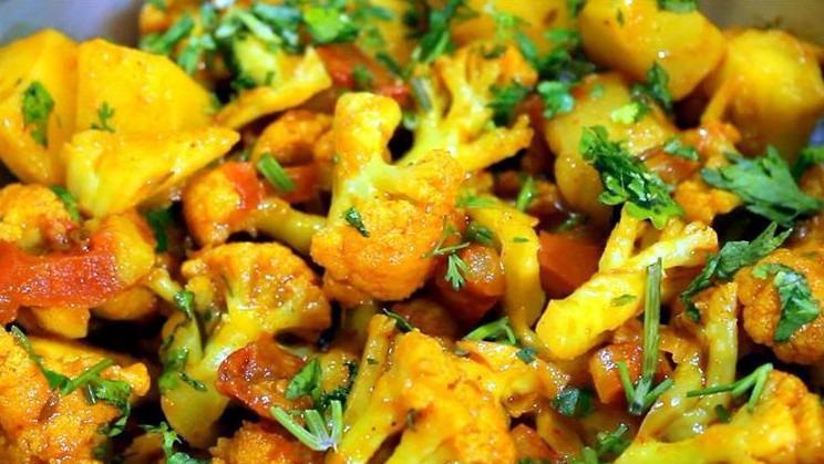 Aloo Gobi (Potato & Cauliflower) · Cauliflower and potato cooked in onion and tomato sauce in combination with Himalayan herbs and spices.