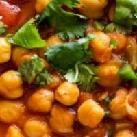 Channa Masala · Chickpeas cooked in onion and tomato sauce with the perfect combination of Himalayan herbs a...
