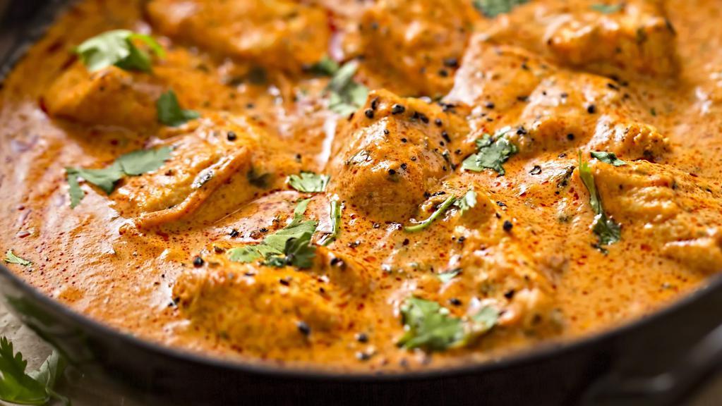 Chicken Tikka Masala · Marinated boneless chicken cubes baked in clay oven and then cooked in creamy onion & tomato sauce with the perfect combination of Himalayan herbs and spices.