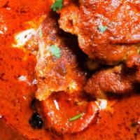 Butter Chicken · Marinated boneless chicken baked in clay oven and then cooked in buttery creamy onion and to...