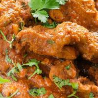 Chicken Curry · Tender boneless chicken cooked in tomato and onion gravy with the perfect combination of Him...