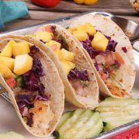 Fish Or Shrimp Tacos · Fried or grilled. Served with pico de gallo, pineapple, red cabbage and chipotle sauce.