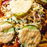 Humble Fries · Seasoned fries topped with melted cheddar cheese, Nashville Nuggs, vinegar based slaw, pickl...