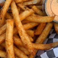 Fries · Fries seasoned with mild spice and salt.