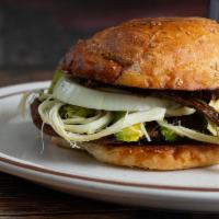 Cemita Poblana · Served with avocado fresh cheese chipotle onions and mayonnaise.