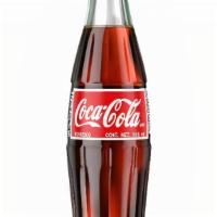 Mexican Coke · 12 oz mexican cane sugar Coca Cola in a glass bottle (requires bottle opener)
