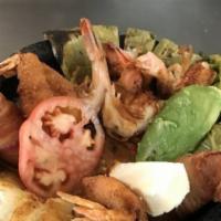 Molcajete Ranchero · Grilled chicken, carne asada, mexican sausage(chorizo) cactus, onions, cheese, avocado, molc...