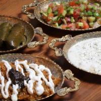 Combination Platter /  پیش غذا شهرزاد · A combination of Dolmeh, Kashk-e-Bademjan (eggplant), Shirazi Salad, and Mast-O-Khiar.