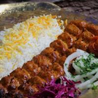 Chicken Koobideh / کوبیده مرغ · One skewer of fresh ground chicken prepared with onions, herbs, and spices.
