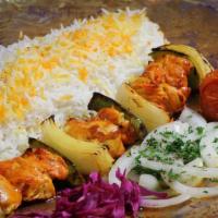Chicken Shish Kabob / شیش کباب جوجه · A skewer of marinated chicken breast charbroiled with bell реppers and onions.