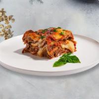 Classic Manic Lasagne · Layers of pasta, ricotta, mozzarella, ground beef, and tomato sauce baked in an oven and top...