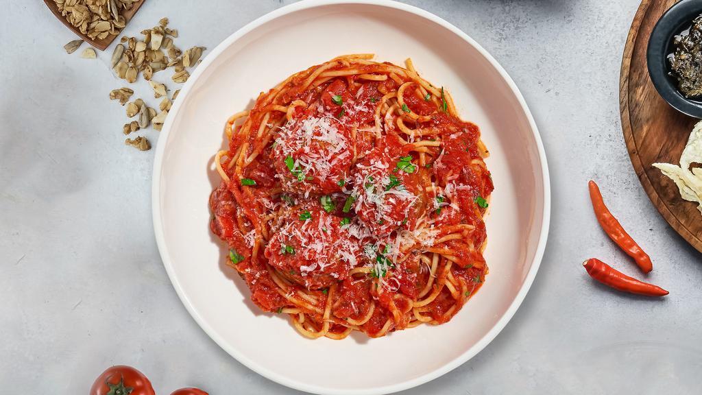 S&M Pasta · Fresh spaghetti and homemade ground beef meatballs served with rossa (red) sauce, red pepper flakes, and parmesan.