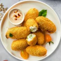 Jolly Jalapeno Poppers · (Vegetarian) Fresh jalapenos coated in cream cheese and fried until golden brown.