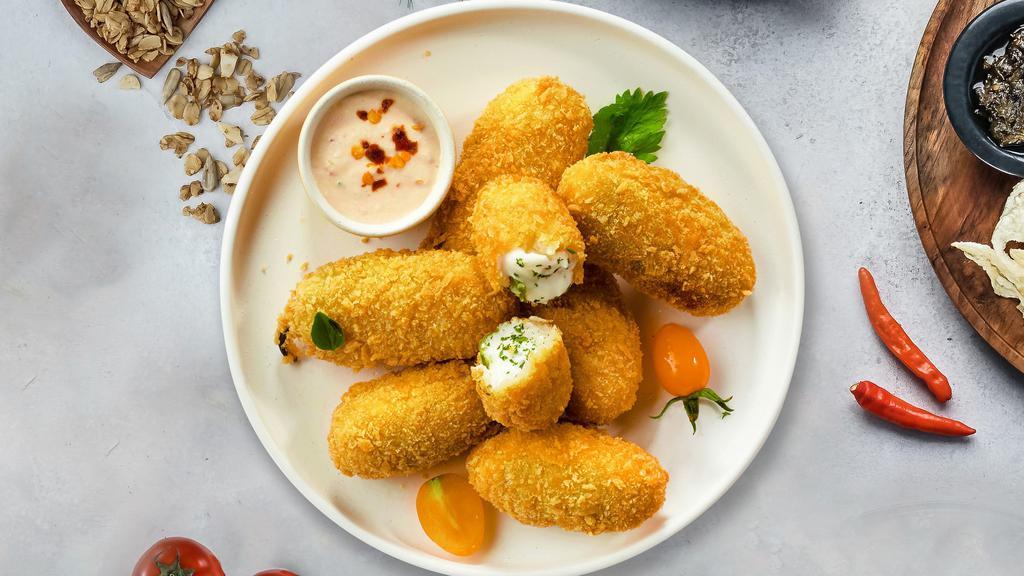 Jolly Jalapeno Poppers · (Vegetarian) Fresh jalapenos coated in cream cheese and fried until golden brown.