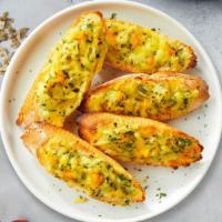 The Cheesy Great Garlic Bread · (Vegetarian) Housemade bread toasted and garnished with butter, garlic, mozzarella cheese, a...