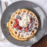 Very Berry Waffles · Served with blueberries, raspberries, strawberries, and strawberries, with a swirl of whip c...