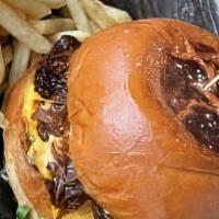 Smash Burger  		 · Caramelized onions, double grilled patties, American cheese, Tavern sauce, Kosher pickles on...