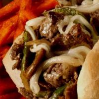 Philly Steak Sandwich   · N.Y. steak thinly sliced & grilled, sautéed mushrooms, onions, peppers, Swiss cheese toasted...