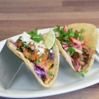 2 Tacos · Choose your tacos asada, carnitas and chicken.