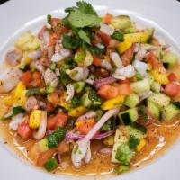 Ceviche Fish · Fish marinated in lemon juice, cucumbers, tomatoes, onions, cilantro, and spices.