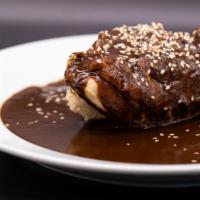 Mole Negra · Chicken served in salsa of guajillos chilles, chocolate, sesame seen served with rice and bl...