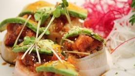 What The Heck Roll · In spicy crab, soft shell crab wrapped with radish. Top with spicy tuna, avocado, ponzu, and...