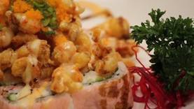 Popcorn Lobster Roll · In CA roll top with fried crawfish, eel sauce, spicy mayonnaise, and miso aioli.